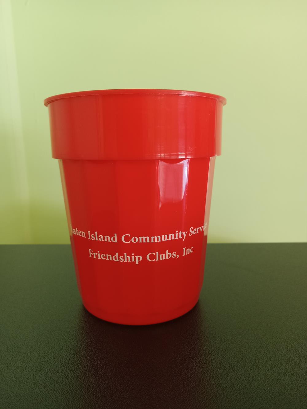 Customer photo from Jennifer of our Stadium Cup - 16 oz. - Fluted, a red cup on a black surface