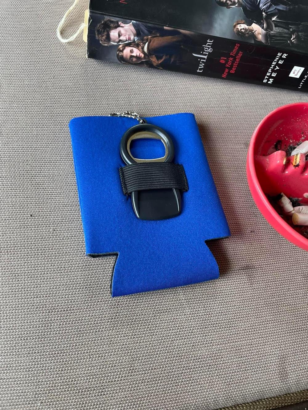 Customer photo from Arlene of our Can Kooler with Bottle Opener, a keychain in a blue drink holder