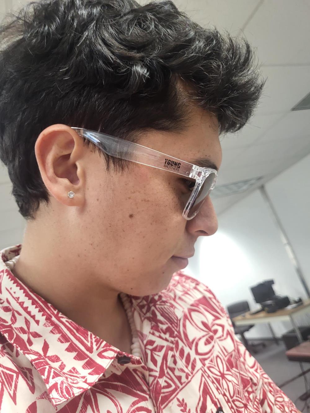 Customer photo from CJ of our Risky Business Sunglasses - Clear, a person wearing sunglasses