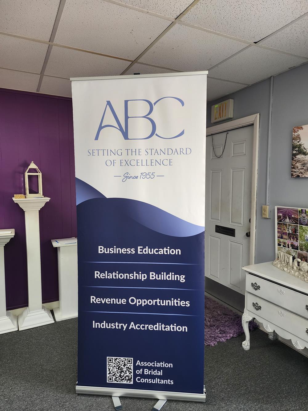Customer photo from Veronica of our Aurora Retractable Banner Display - 34", a sign in a room