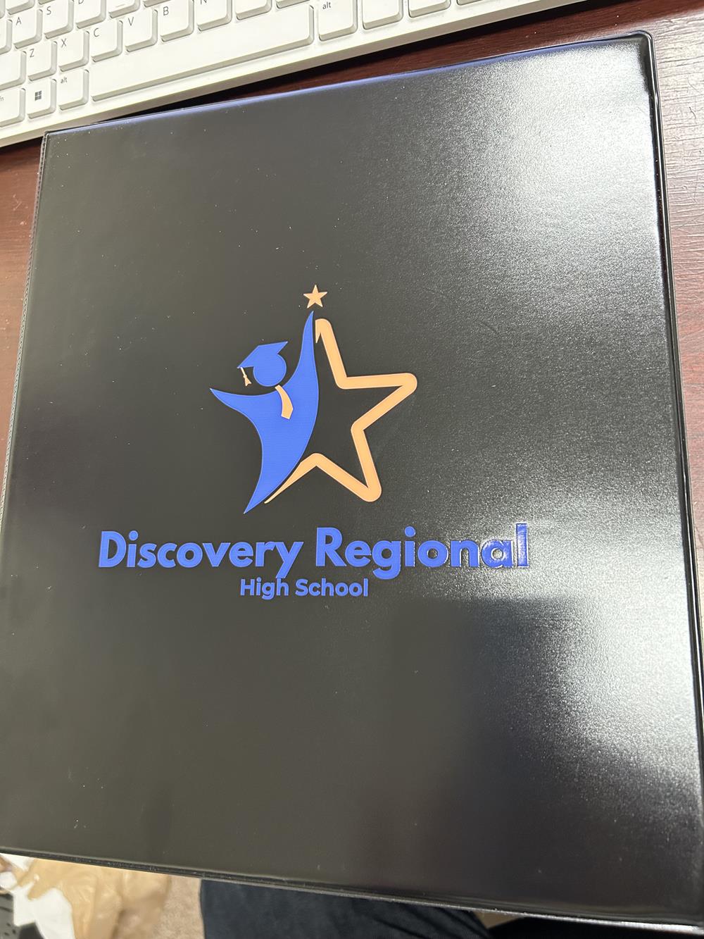 Customer photo from Sonya of our Vinyl Ring Binder - 3/4", a black folder with a logo and a star