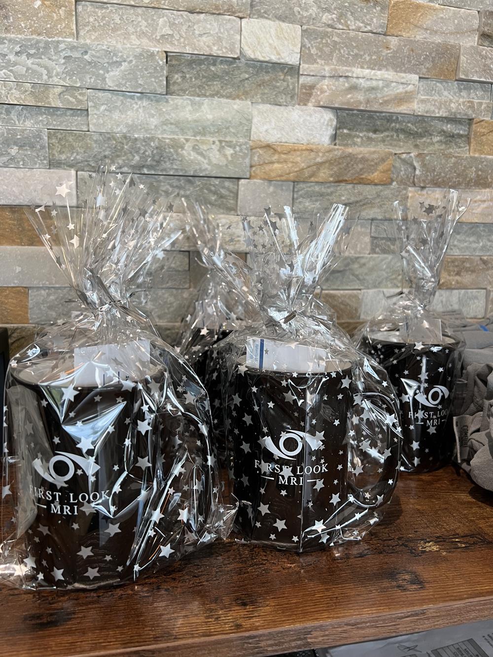 Customer photo from Donna of our Tall Campfire Mug - 12 oz., a group of black mugs wrapped in plastic