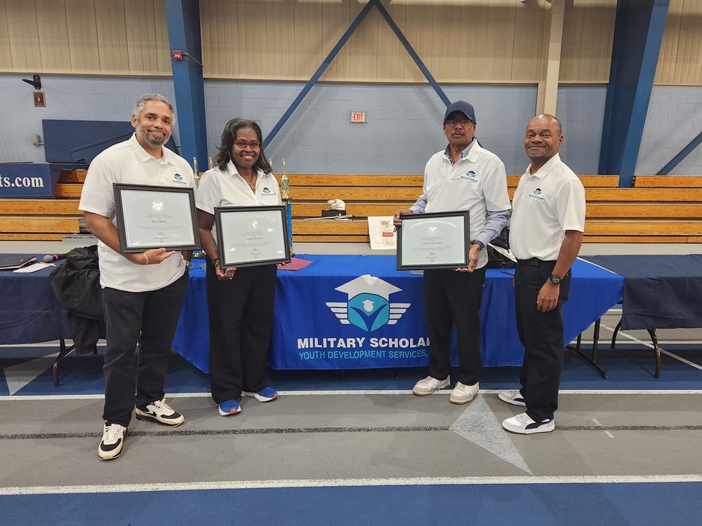 Customer photo from Marcus of our Serged Closed-Back Table Throw - 6 feet, a group of people holding certificates