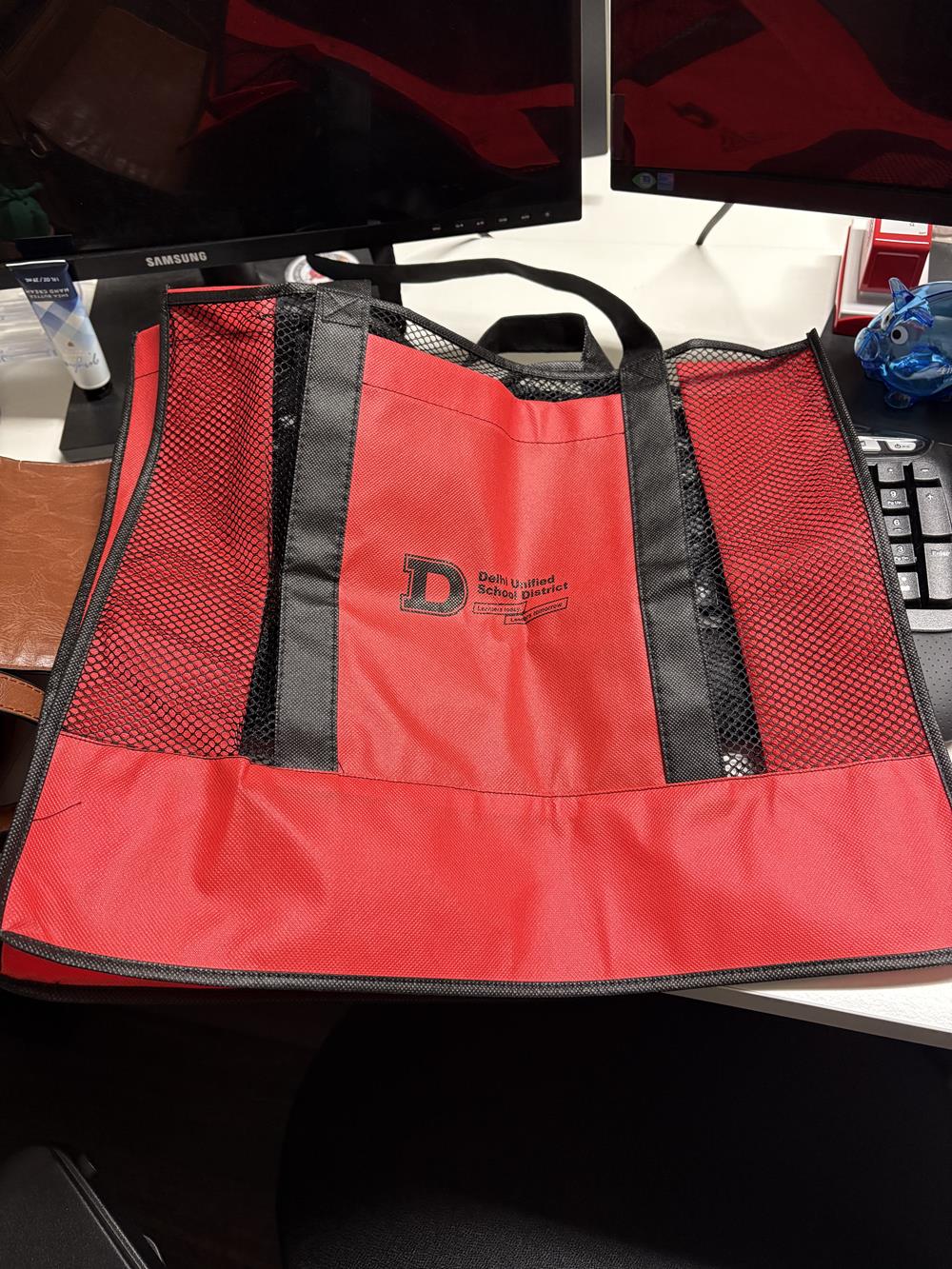 a red bag on a desk