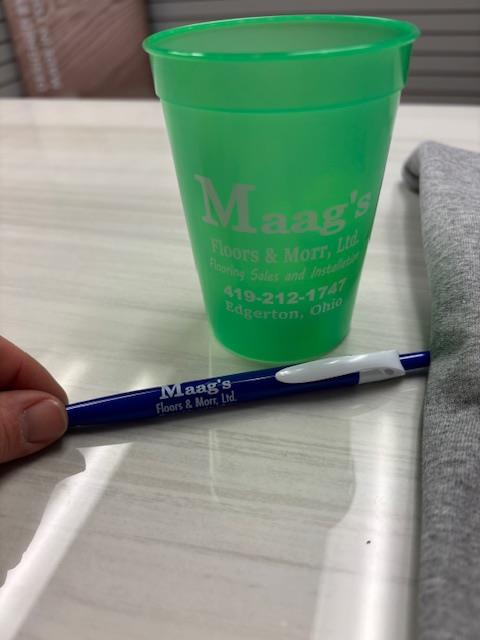 Customer photo from Jennifer of our Simplistic Pen, a green cup and pen on a table