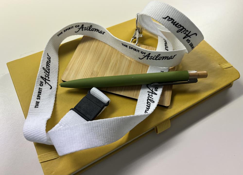 Customer photo from Charlotte of our Lanyard with Metal Lobster Clip - 3/4", a pen on a yellow notebook