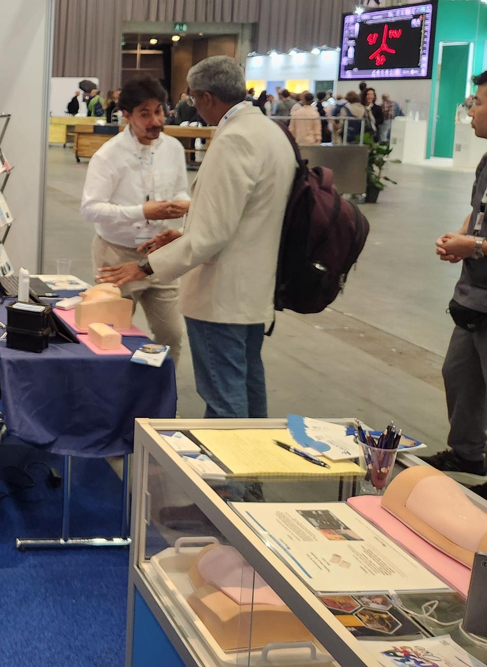 Customer photo from Laura of our Cubano Pen - Opaque, a man standing next to a man with a backpack