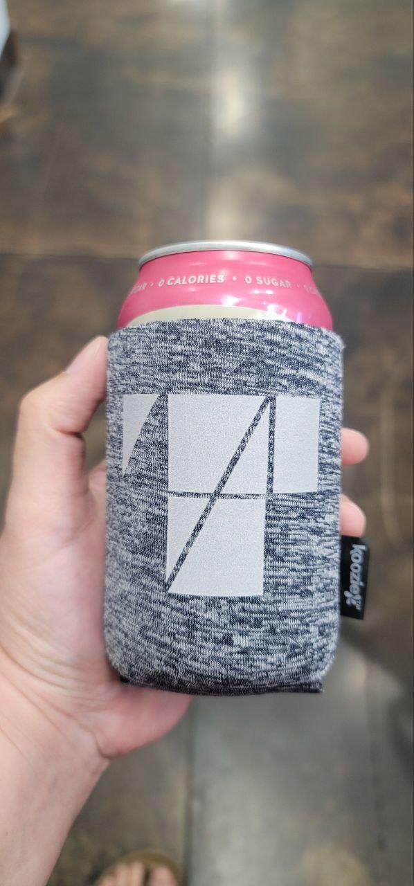 Customer photo from Anna of our Koozie® Heather Collapsible Can Cooler, a hand holding a can