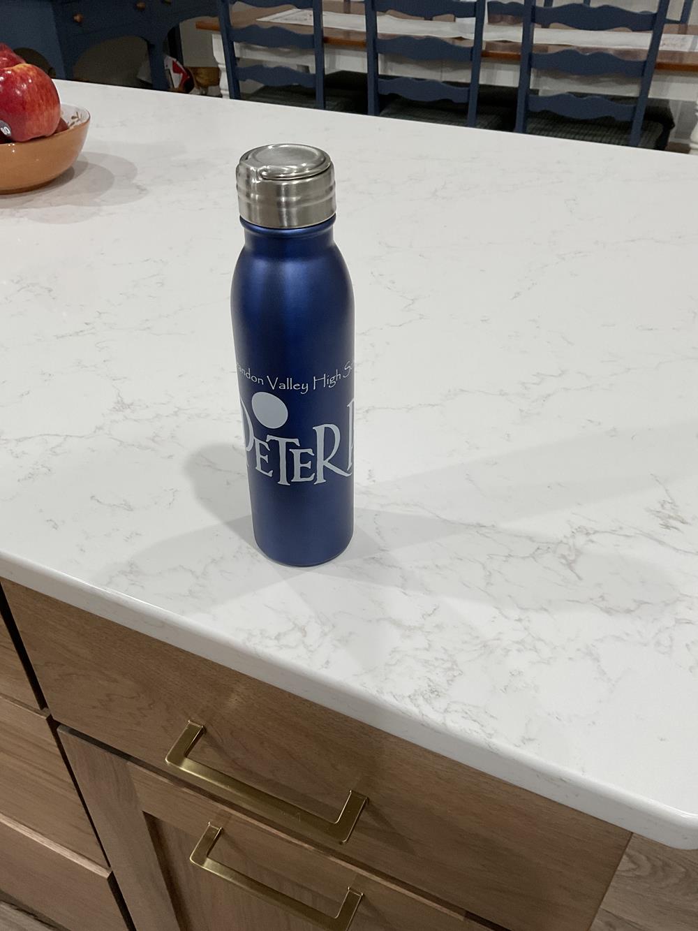 Customer photo from Steven of our Nick Aluminum Bottle - 24 oz., a blue water bottle on a counter