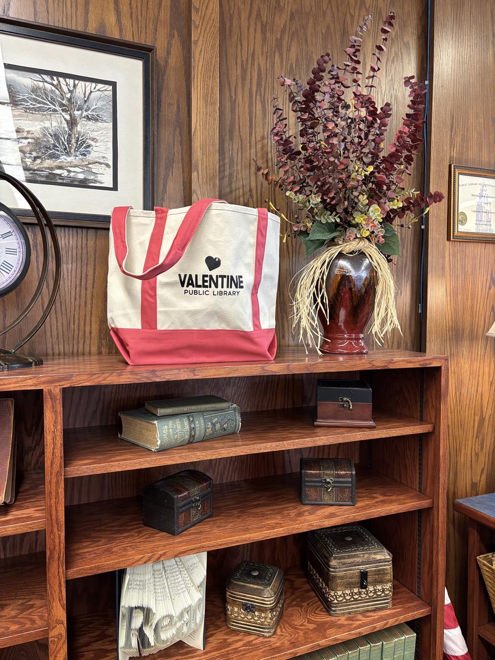 Customer photo from Carrie of our Two-Tone Accent Gusseted Tote Bag, a shelf with books and a bag on it