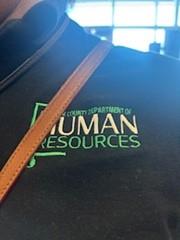 Customer photo from Tamika of our Gildan Softstyle Cotton Pique Polo - Men's, a close up of a bag