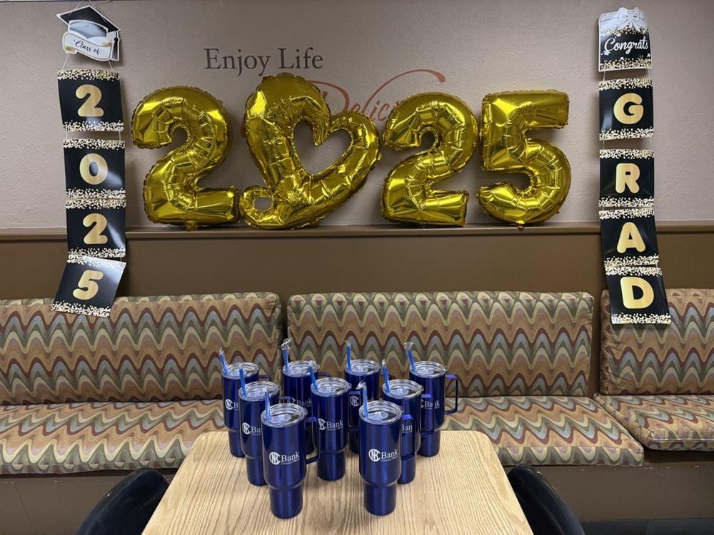 Customer photo from Vanessa of our Color Accent Bistro Ceramic Mug - 20 oz., a table with blue cups and gold balloons on the wall
