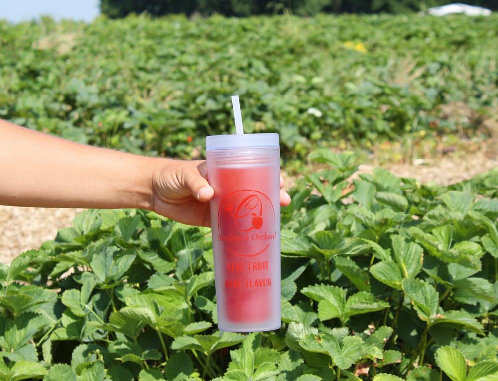 Customer photo from Daryl of our A4 Cooling Performance Tee - Men's - Screen, a hand holding a cup with a straw