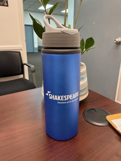 Customer photo from Rhonda of our Sip & Flip Aluminum Bottle - 24 oz. - 24 hr, a blue water bottle on a table