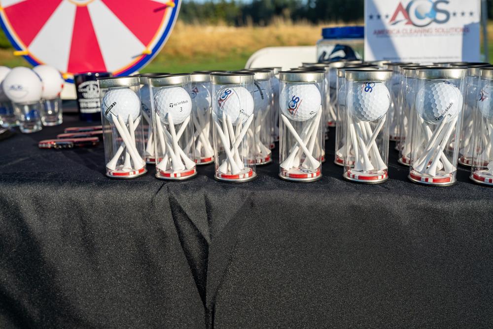 Customer photo from Jose of our Letter Opener - Opaque, a group of golf balls in clear containers on a table