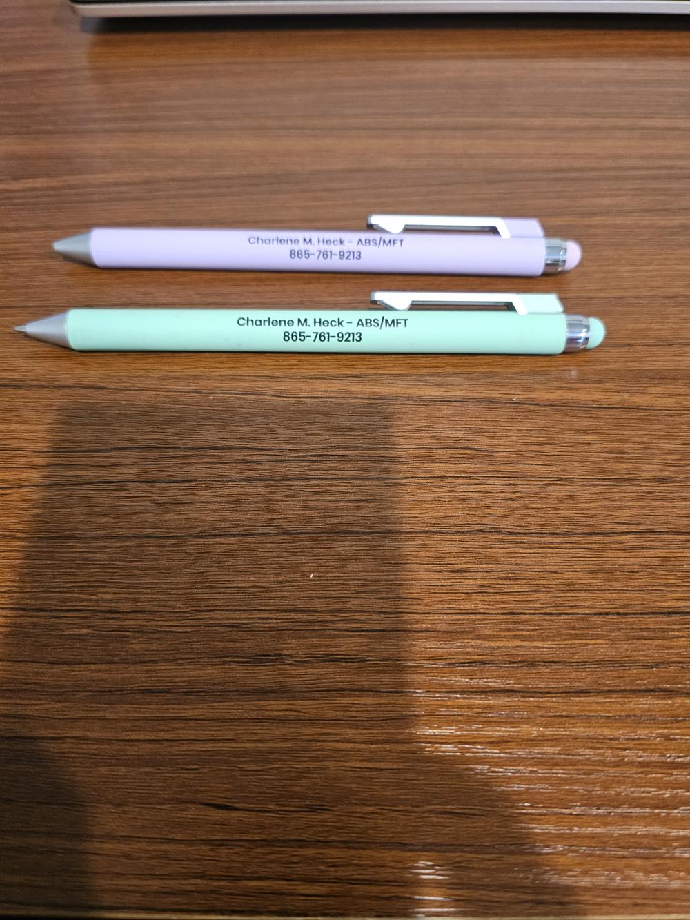 Customer photo from Charlene of our Matador Soft Touch Stylus Pen, two pens on a table