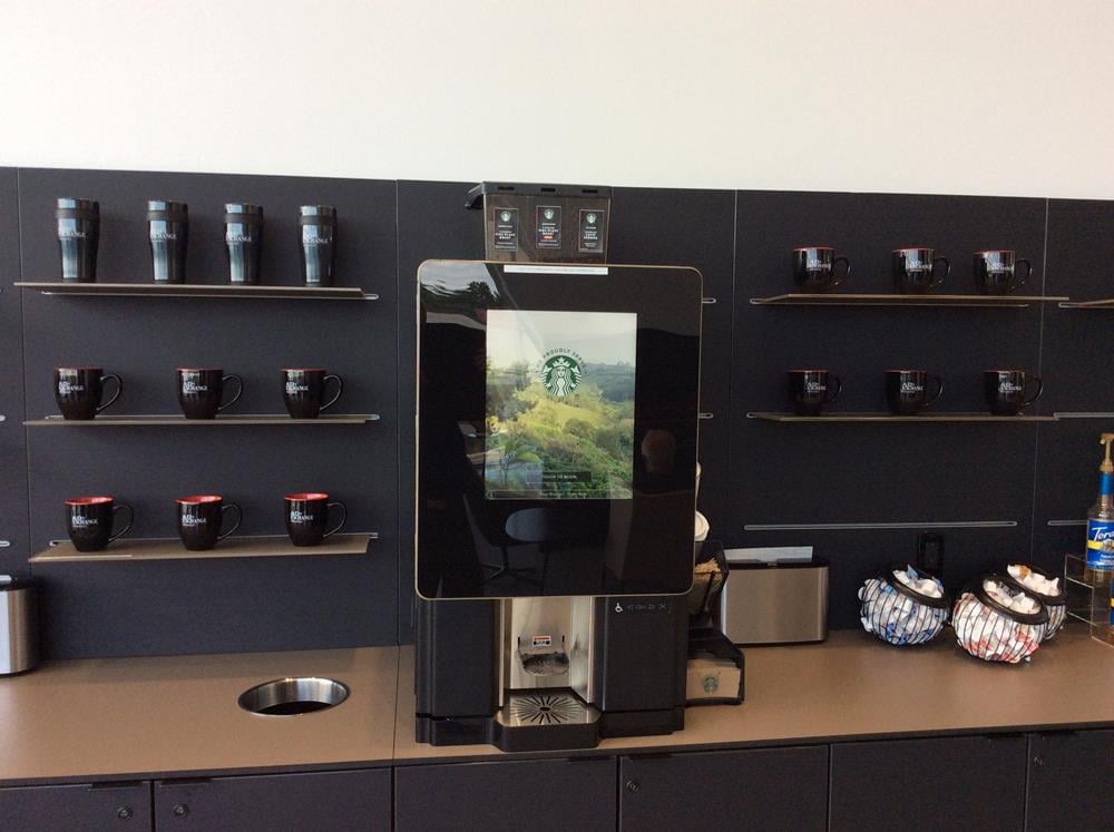 Customer photo from Carl of our Zapata Bistro Ceramic Mug - 14 oz., a coffee machine on a counter