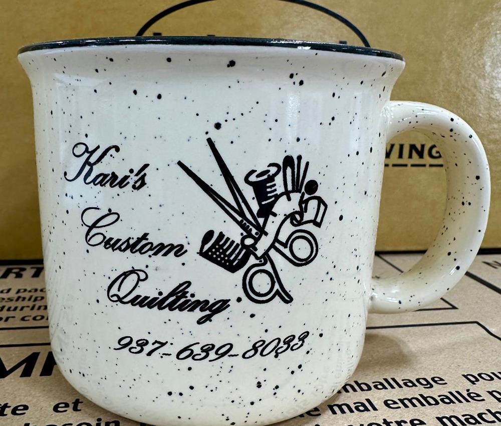 Customer photo from Kari of our Campfire Ceramic Mug - Colors - 15 oz., a white mug with black speckled design