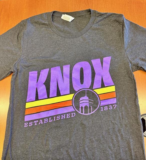 Customer photo from Stacia of our Bella+Canvas Tri-Blend T-Shirt - Men's - Screen, a grey shirt with purple and orange text