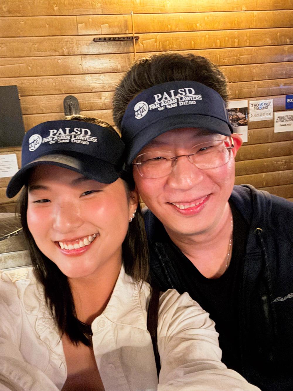 Customer photo from James of our Flexfit Cool & Dry Sport Cap, a man and woman taking a selfie