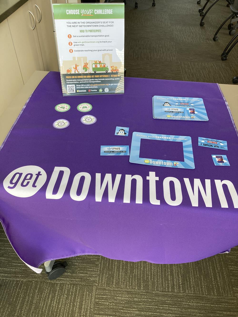 Customer photo from Lilliane of our Serged Table Runner - 28", a purple tablecloth with white text and a purple tablecloth with white text
