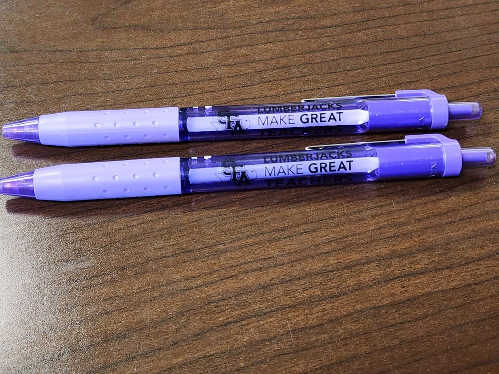 Customer photo from Shunta of our Splat Mood Pencil - 24 hr, two purple pens on a wood surface