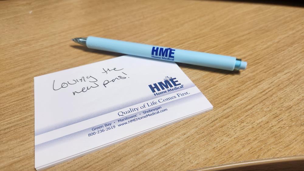 Customer photo from Tristin of our Slimcard Pocket Magnifier, a pen on a business card