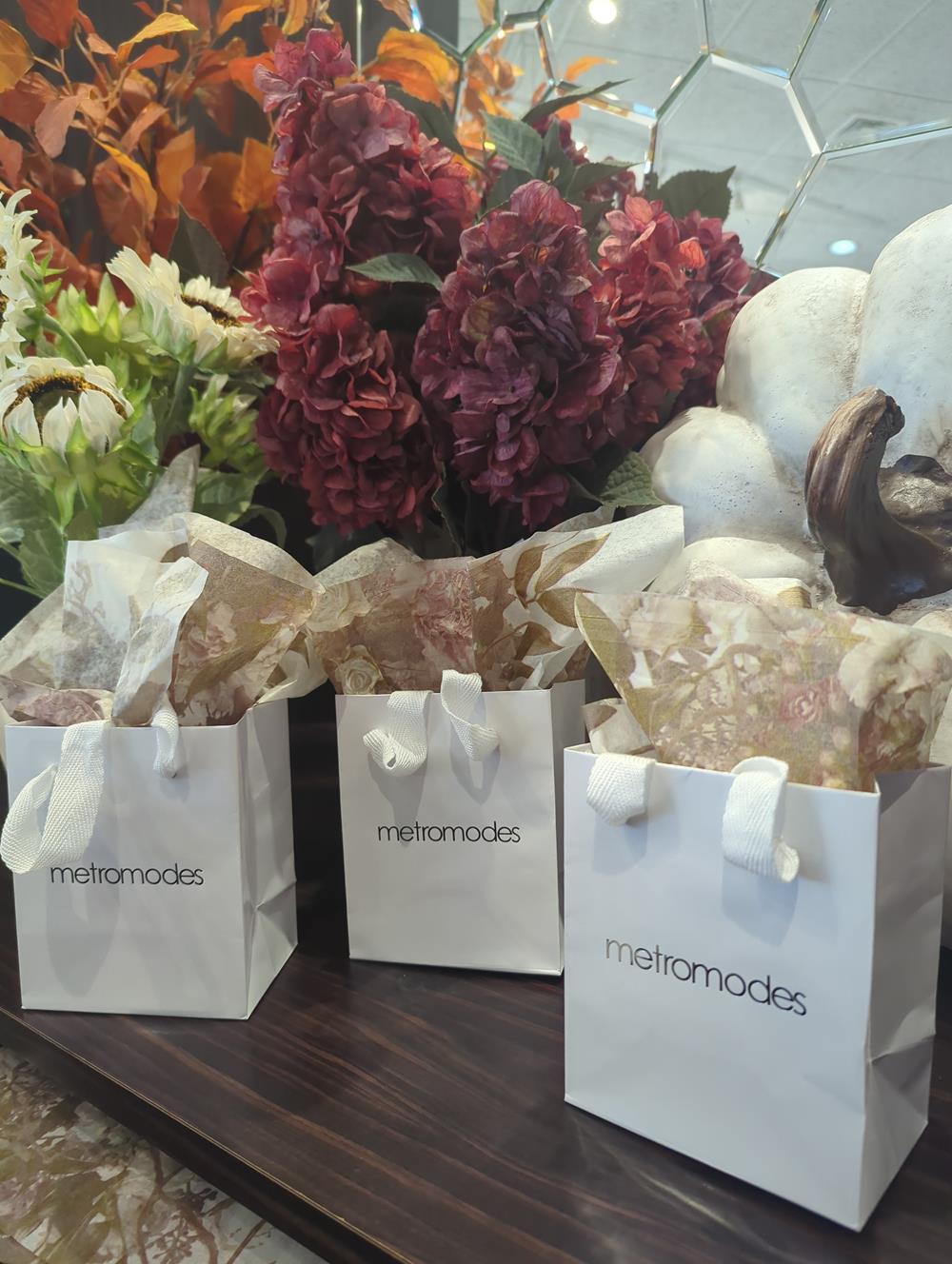 Customer photo from Andrea of our Gloss Eurotote - 5-1/2" x 4-1/2", a group of white bags with flowers