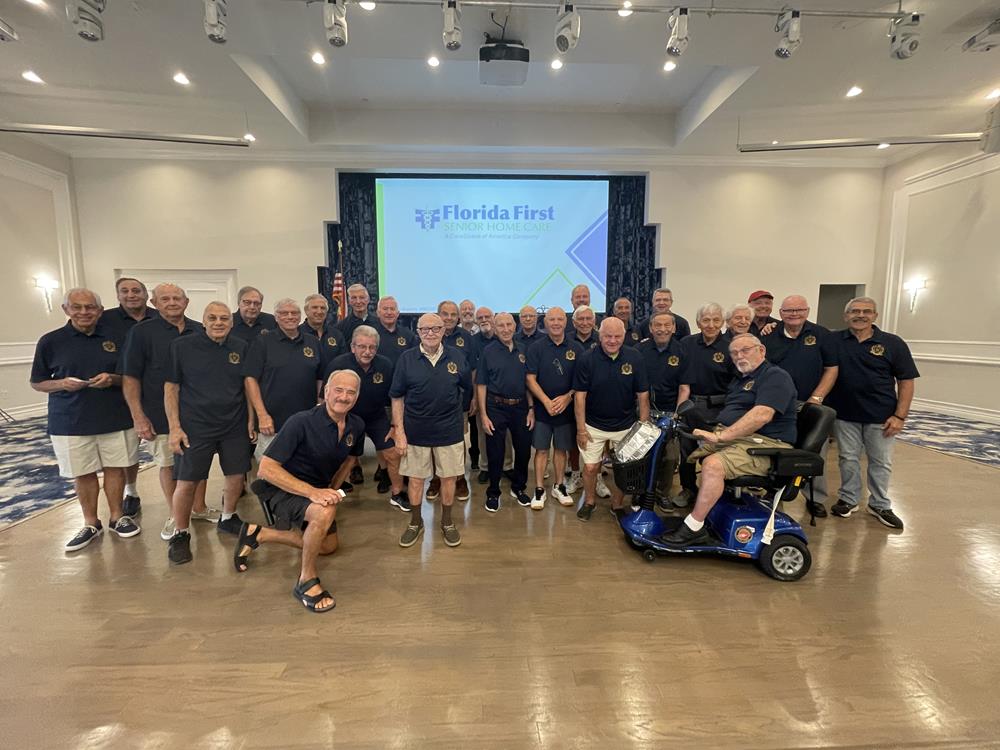 Customer photo from Jeffrey of our Silk Touch Performance Sport Polo - Men's - Embroidered, a group of men posing for a photo