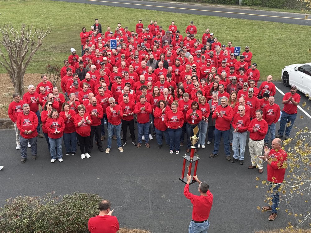 Customer photo from Kim of our Port 50/50 Blend Long Sleeve T-Shirt - Screen, a group of people in red shirts