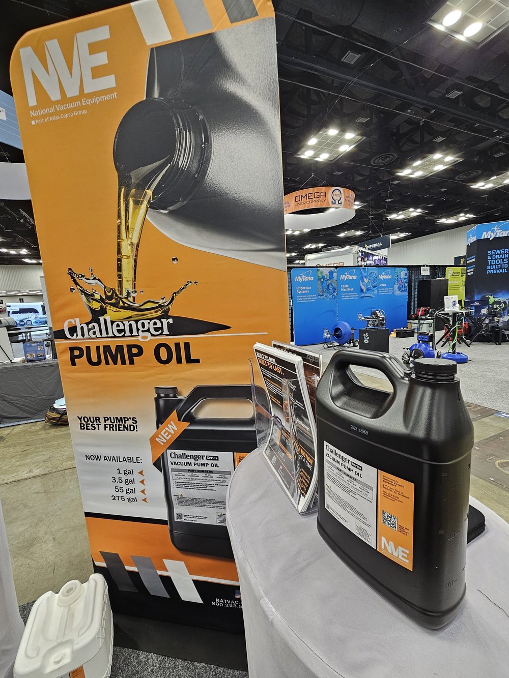 Customer photo from Jordan of our EuroFit Banner Stand - 7-1/2' x 3', a black container with liquid pouring out of it