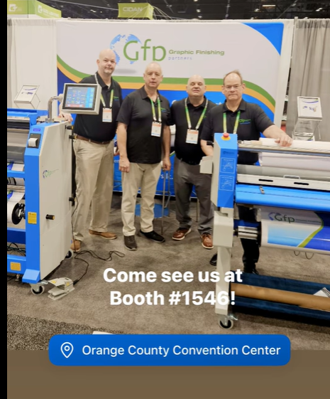 Customer photo from Kelly of our Under Armour Stretch Performance Polo - Men's - Embroidered, a group of men standing in front of a large machine