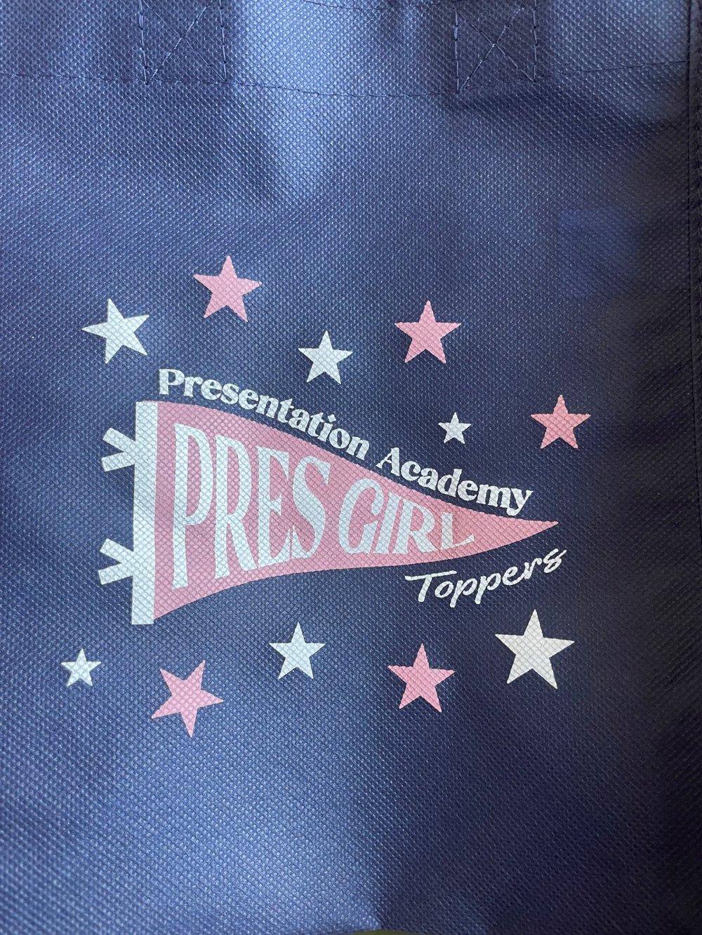 Customer photo from Kaci of our Book Tote, a close up of a logo