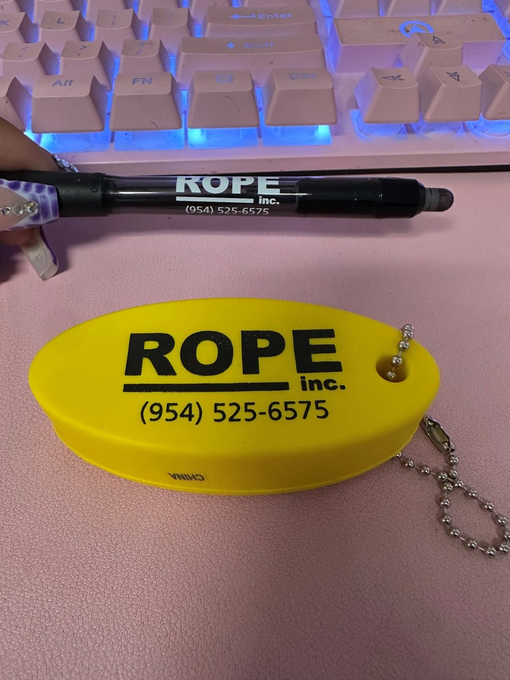 Customer photo from cathrine of our Floating Keychain, a marker pen on a yellow oval shaped object