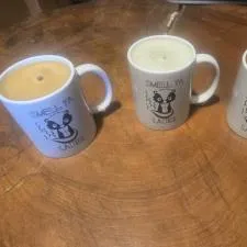 Customer photo from Jeremy of our Value White Coffee Mug - 11 oz, a group of coffee mugs with candles on a table