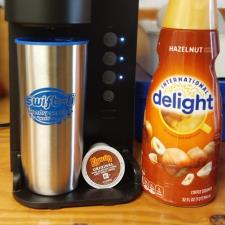 a coffee machine and a bottle of creamer