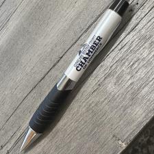 a pen on a wood surface