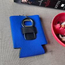 a keychain in a blue drink holder