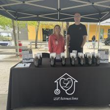 a man and woman standing under a tent