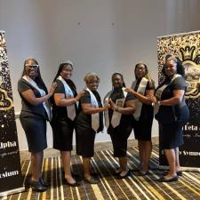 a group of women wearing matching outfits