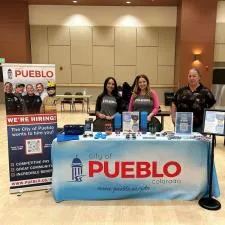 Customer photo from Civil of our Memo Magnet - 5-15/16" x 4", a group of women standing behind a table with signs