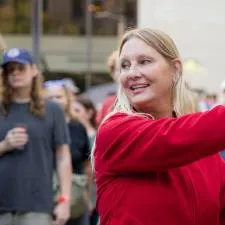 Customer photo from Isabelle of our Brew Pub Glass - 16 oz., a woman pouring a drink from a dispenser