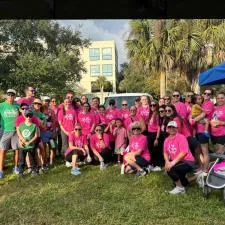 Customer photo from Kaylin of our Optimal Tri-Blend T-Shirt - Men's - Screen, a group of people in pink shirts