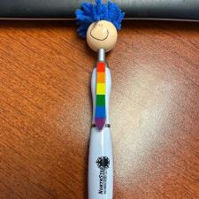 a pen with a rainbow face on it