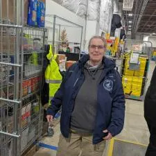 a woman standing in a warehouse