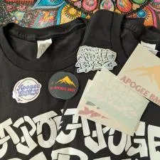 Customer photo from Solomon of our Hanes Authentic T-Shirt - Screen - Colors, a group of black shirts with white text and stickers