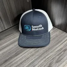 Customer photo from Michael of our Richardson Trucker Snapback Cap, a hat on a wood surface