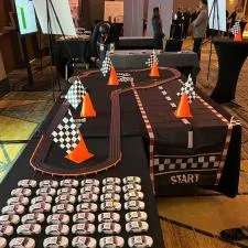 a table with race track and orange cones