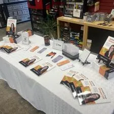 Customer photo from Eden of our Bennington Pen, a table with books and stationery on it
