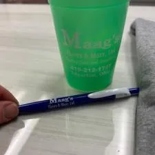 Customer photo from Jennifer of our Mood Stadium Cup - 12 oz., a green cup and pen on a table